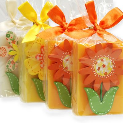 Sheep milk soap decorated with a wooden flower in a cellophane, sorted 