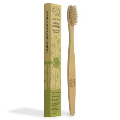 Tooth brush made of bamboo wood packed in a paper-box 